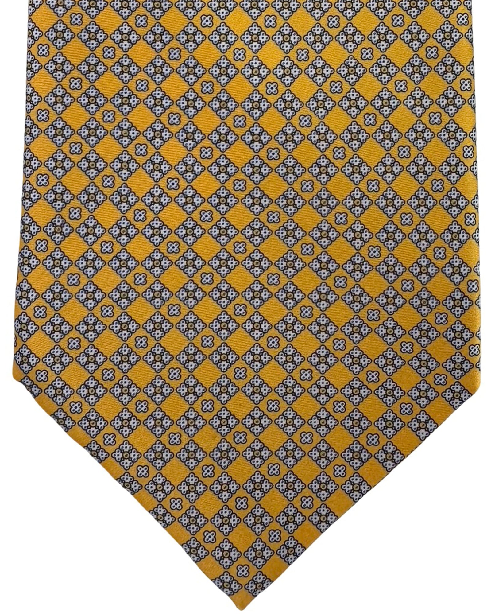 Patterned tie with yellow and gray checkered design on a white background

