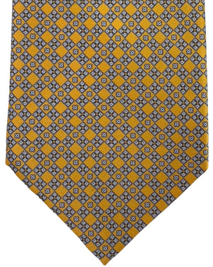Patterned tie with yellow and gray checkered design on a white background


